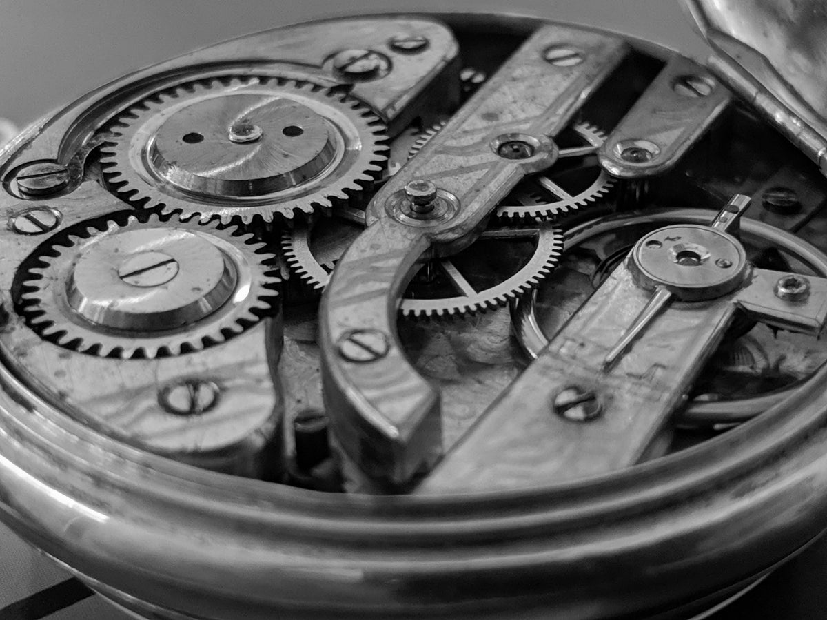 Open timepiece showing movement details